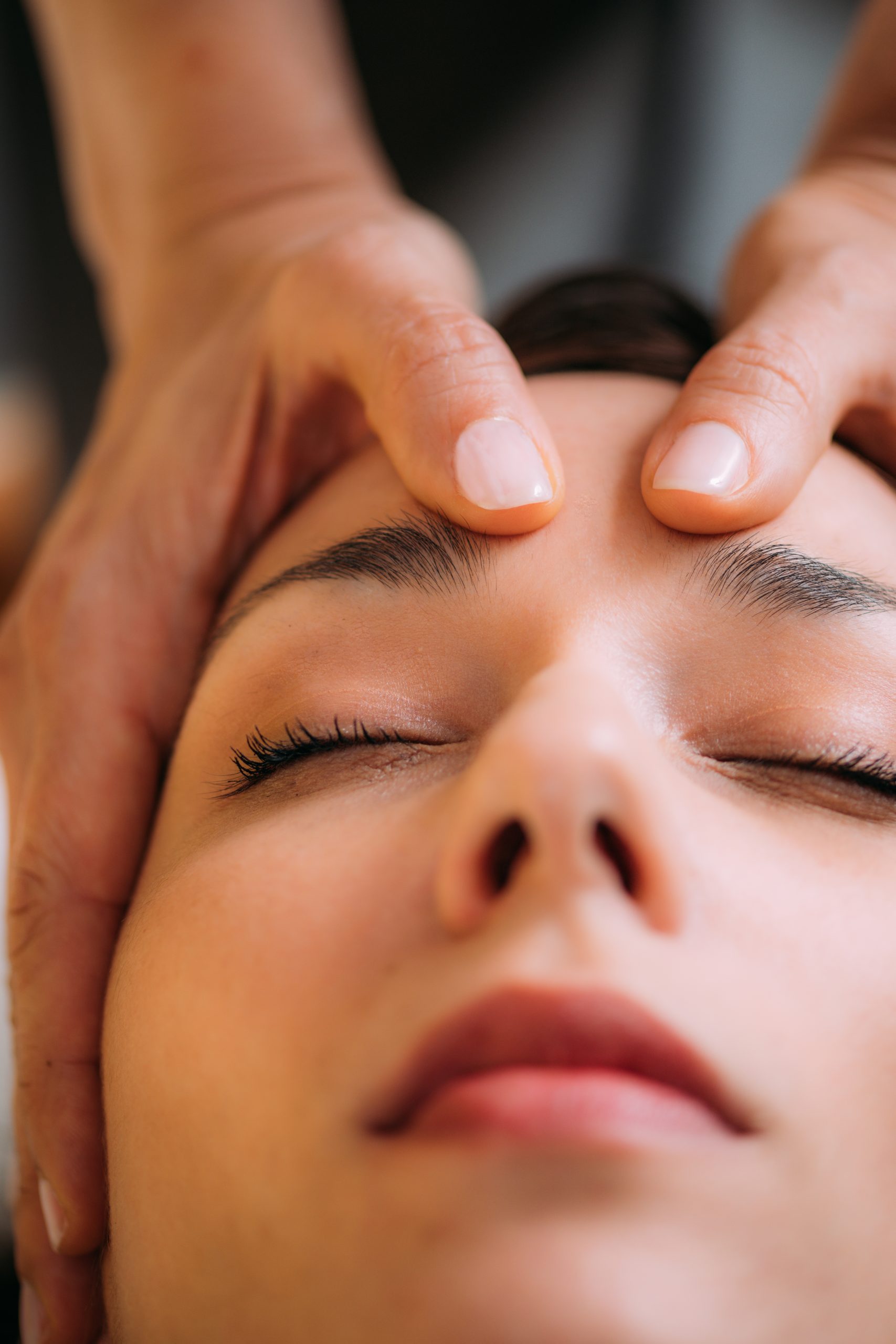 Craniosacral Therapy Massage. CST therapist Massaging of Woman’s Head.